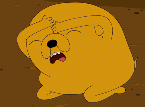 Jake the Dog from Adventure Time, cowering in fear on the ground and hiding his eyes.